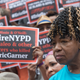 Gwen Carr, Eric Garner’s mother, surrounded by supporters at an NYC rally in July 2018